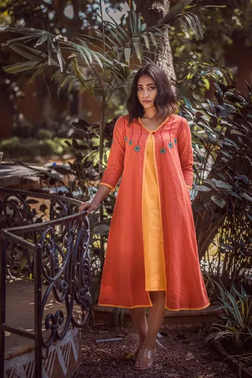 Urmul 'Anmol'Hand Embroidered Orange Kotta doriya dress . 2pc set (Jacket and Slip)